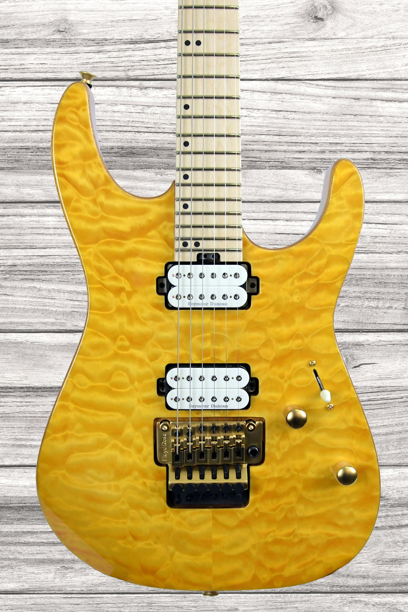charvel-pro-mod-dk24-hh-fr-m-mahogany-quilt-maple-dark-amber_61d71b4dd9cfd.jpg