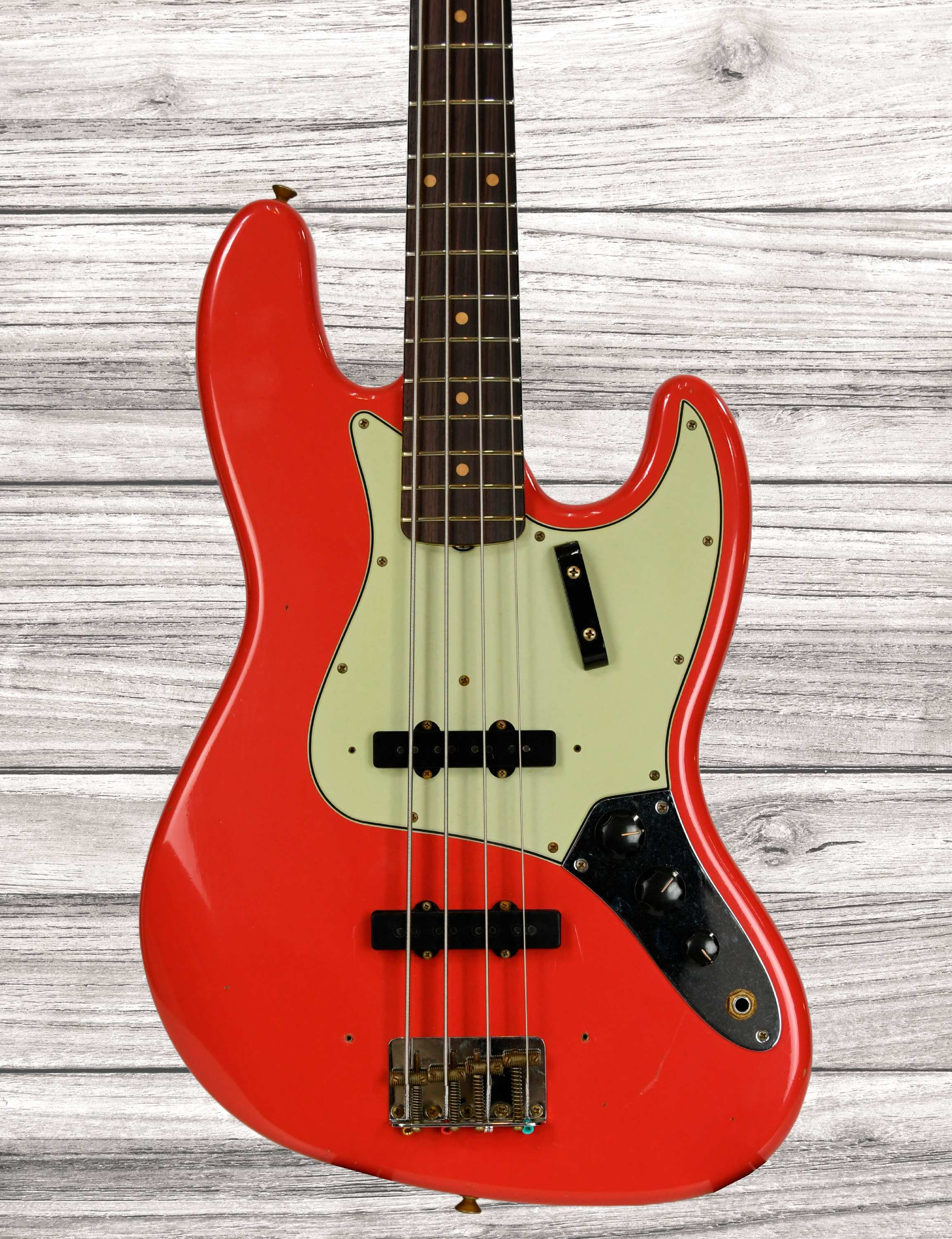 fender-custom-shop-64-jazz-bass-journeyman-aged-fiesta-red_67cae0e197c0f.jpg