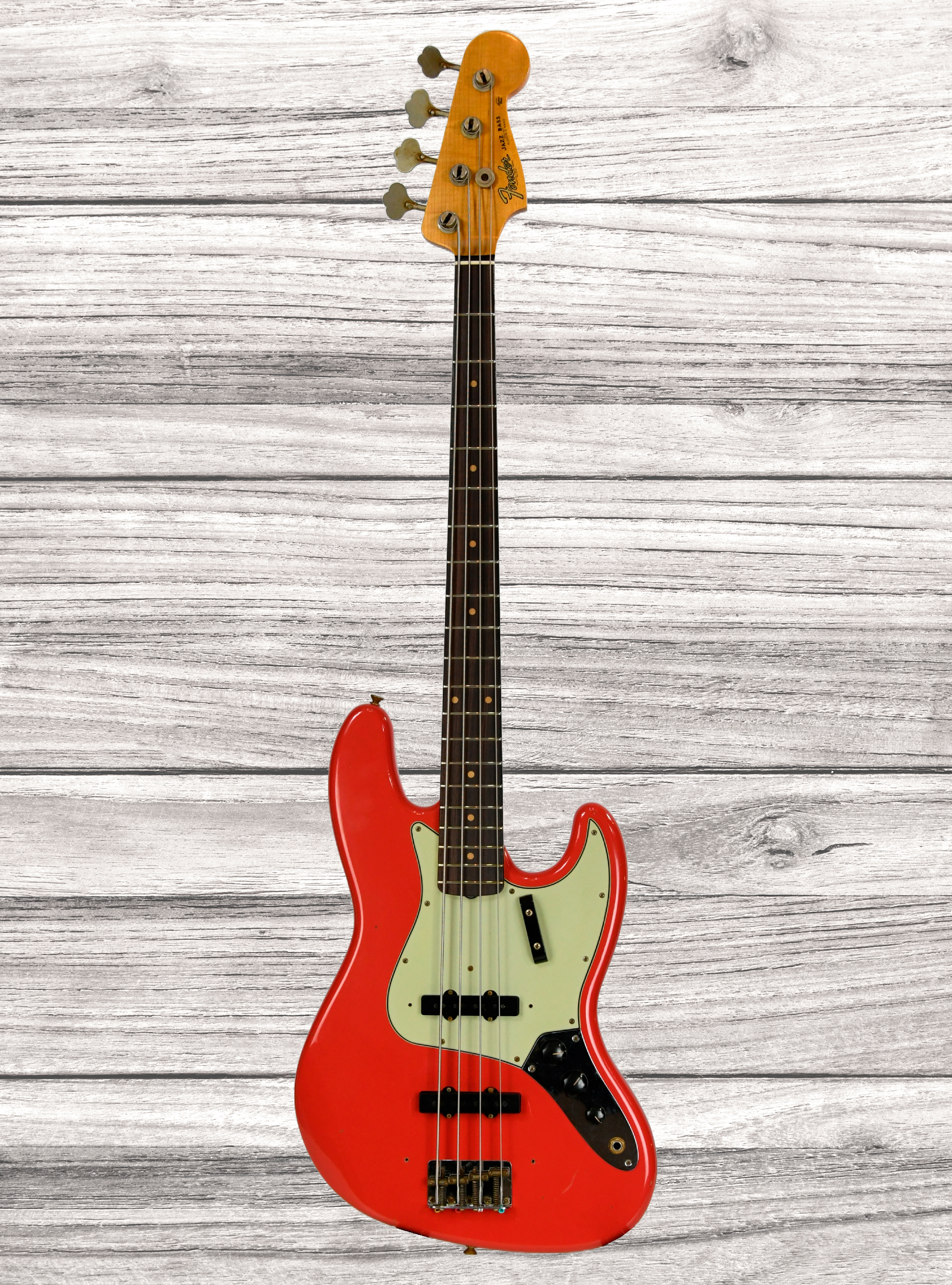 fender-custom-shop-64-jazz-bass-journeyman-aged-fiesta-red_67cae0e99b16b.jpg