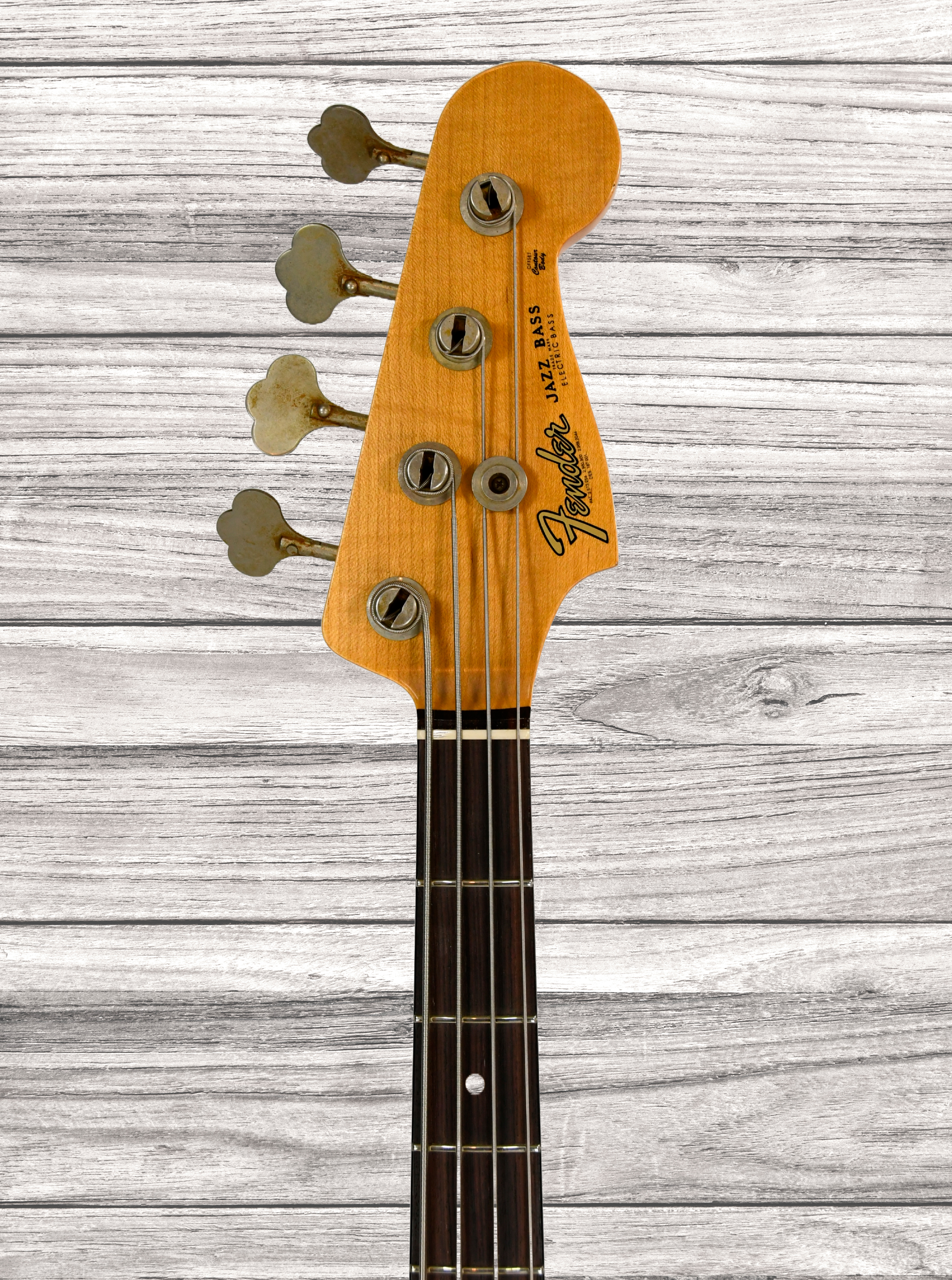 fender-custom-shop-64-jazz-bass-journeyman-aged-fiesta-red_67cae0f588ca7.jpg