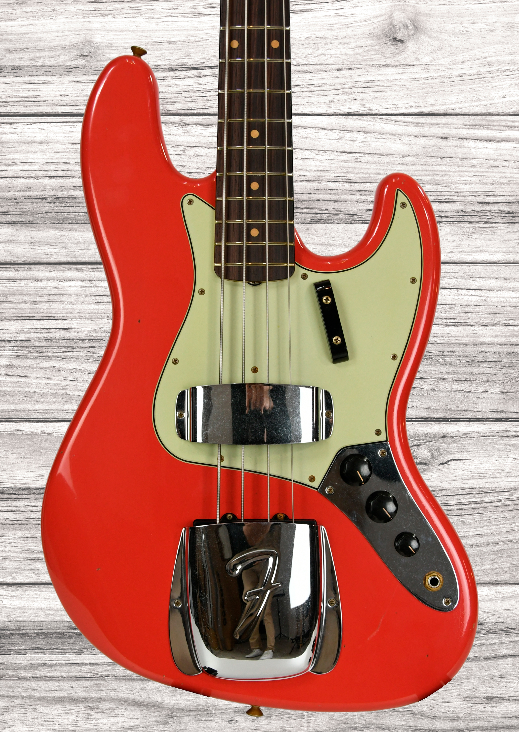fender-custom-shop-64-jazz-bass-journeyman-aged-fiesta-red_67d07ae1749ff.jpg